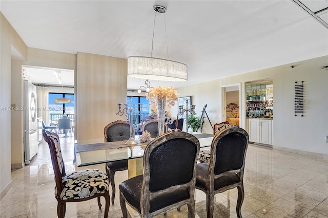 dining space with a chandelier