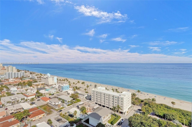 bird's eye view with a beach view and a water view