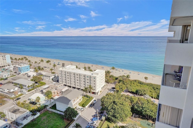 aerial view featuring a water view and a beach view