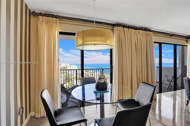 dining room with a water view