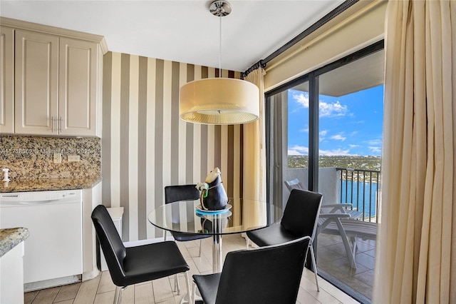 dining space with a water view