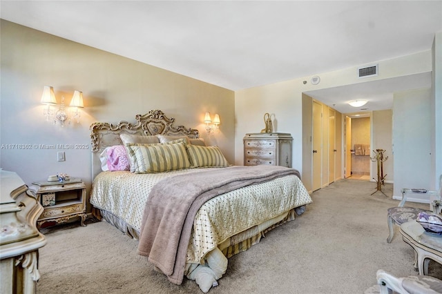 bedroom with light colored carpet