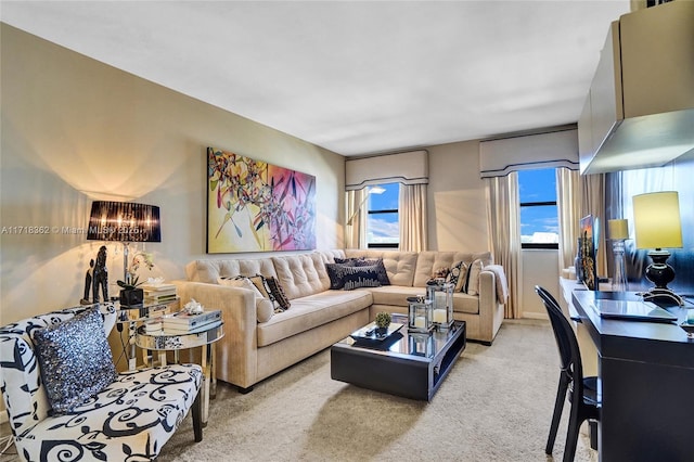 carpeted living room with a chandelier