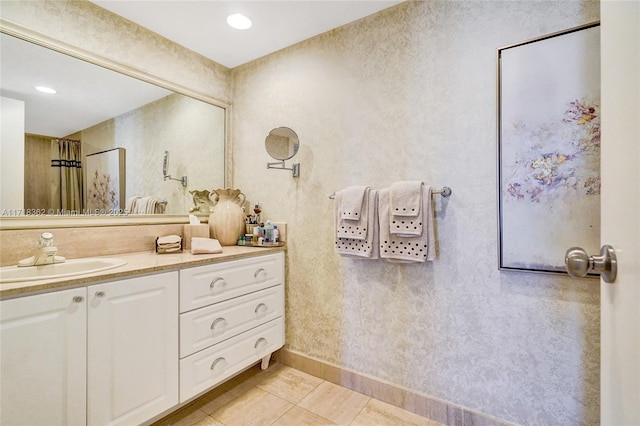 bathroom with tile patterned floors and vanity