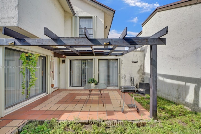 back of house with a pergola and a patio