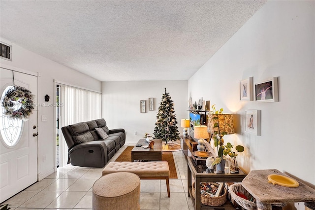 tiled living room with a textured ceiling