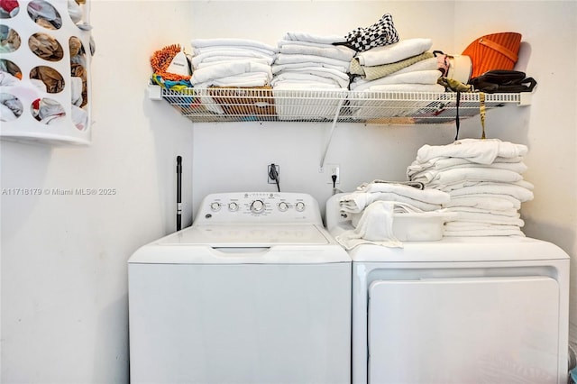 clothes washing area featuring washing machine and clothes dryer