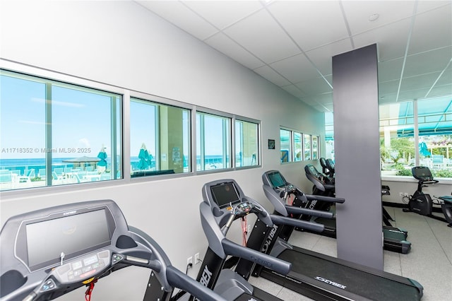 exercise room featuring a drop ceiling