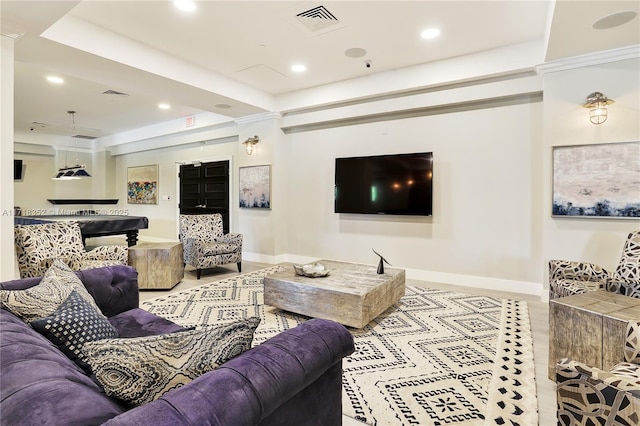 living room with a tray ceiling