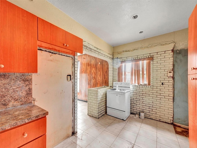 laundry area featuring a textured ceiling