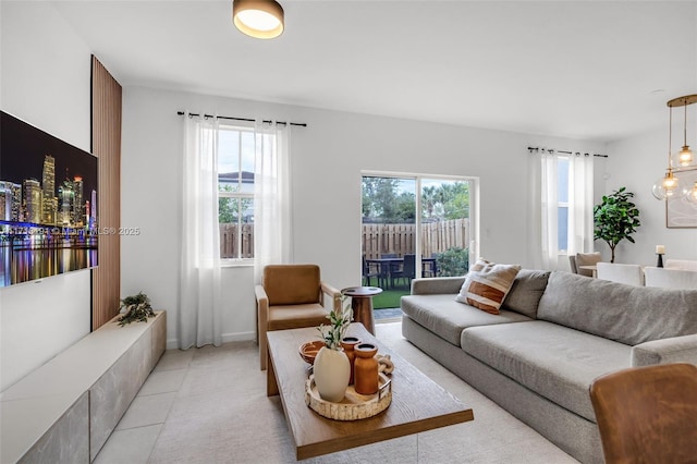 living room with light tile patterned floors and a wealth of natural light