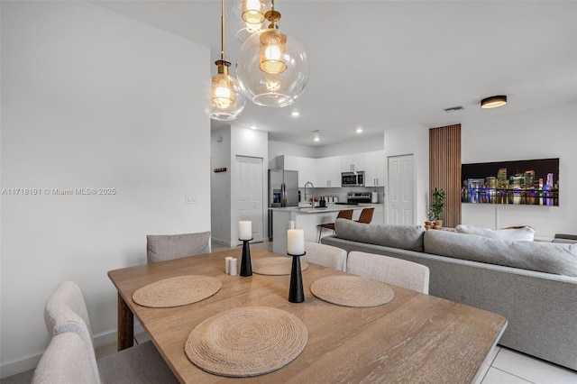 dining area featuring light tile patterned flooring, visible vents, and recessed lighting