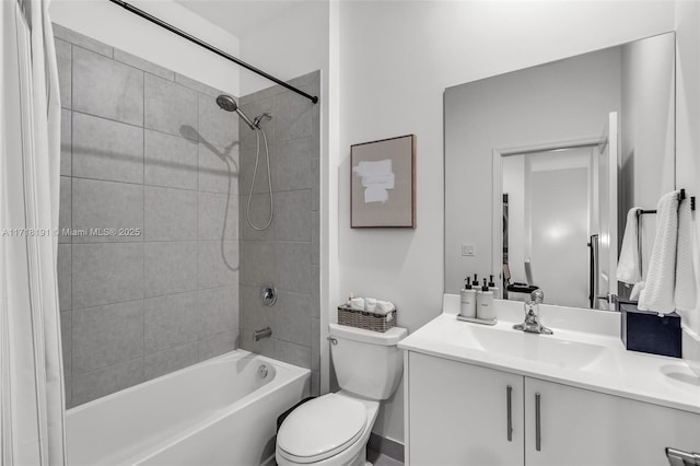 full bath featuring shower / bathing tub combination, vanity, and toilet