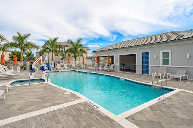 pool featuring a patio area and fence