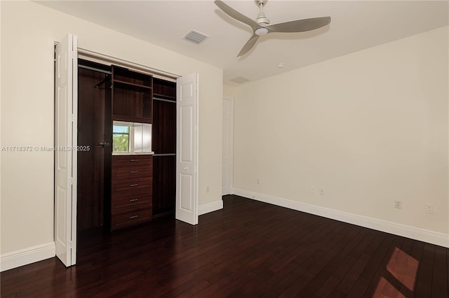 unfurnished bedroom featuring dark hardwood / wood-style flooring, a closet, and ceiling fan