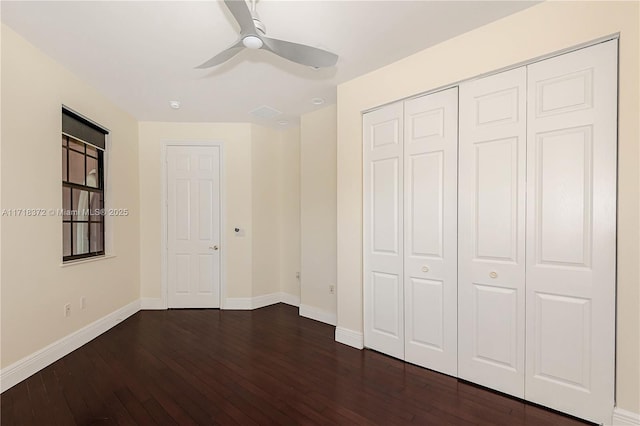 unfurnished bedroom with a closet, ceiling fan, and dark hardwood / wood-style flooring