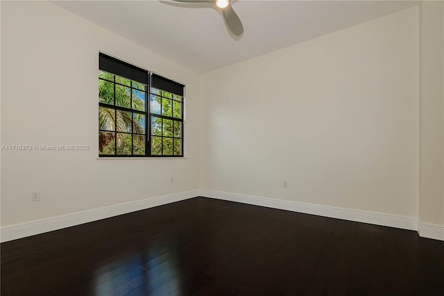 empty room with hardwood / wood-style floors and ceiling fan