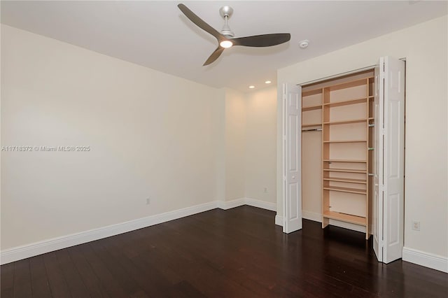 unfurnished bedroom featuring ceiling fan, dark hardwood / wood-style floors, and a closet