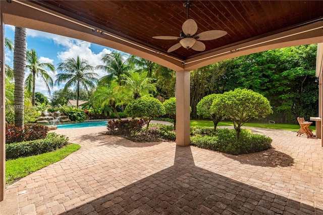 view of patio featuring ceiling fan