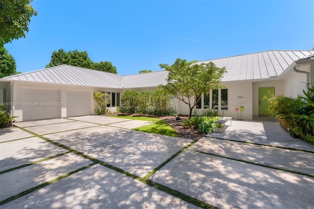 ranch-style house featuring a garage