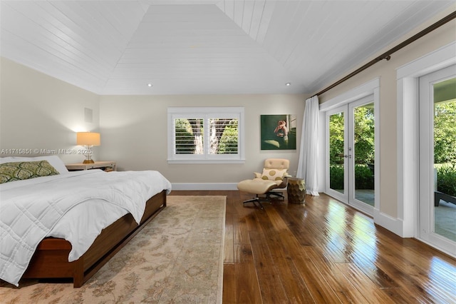 bedroom featuring access to outside, multiple windows, hardwood / wood-style floors, and wood ceiling