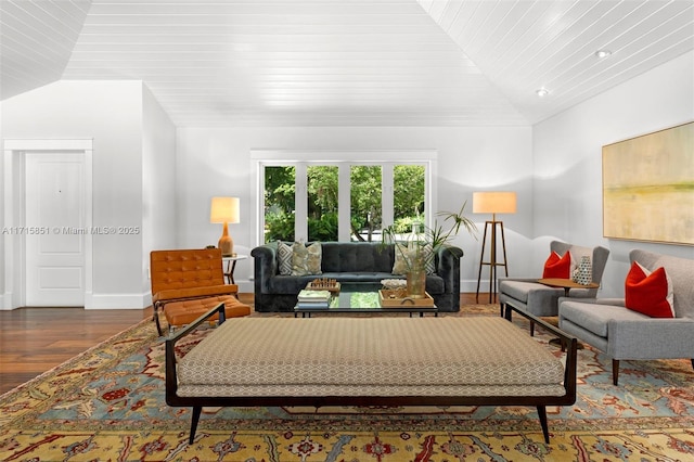 living room featuring hardwood / wood-style floors, wooden ceiling, and lofted ceiling