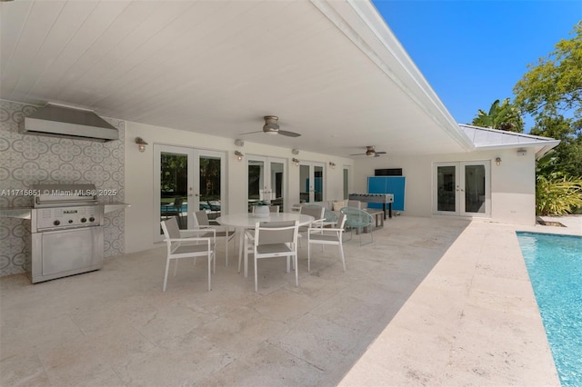 view of patio with ceiling fan, area for grilling, grilling area, and french doors