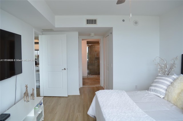 bedroom featuring light hardwood / wood-style flooring and ceiling fan