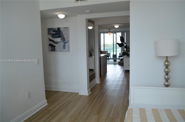 hallway with light wood-type flooring