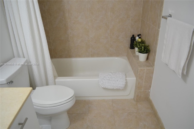 bathroom featuring tile patterned floors, vanity, and toilet