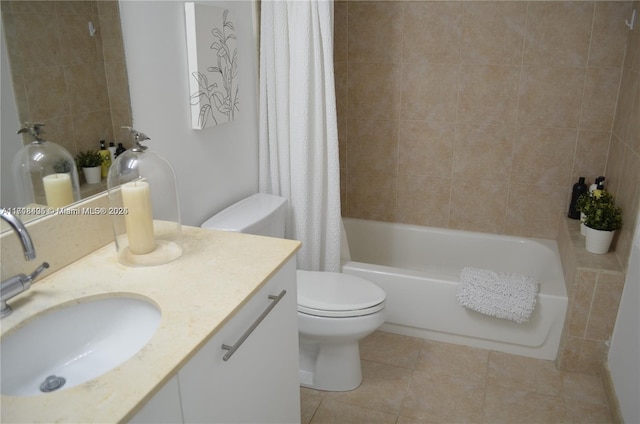 full bathroom with tile patterned floors, shower / tub combo with curtain, vanity, and toilet