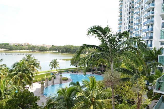 view of pool featuring a water view