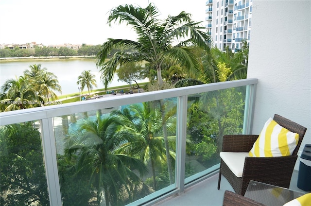 balcony featuring a water view