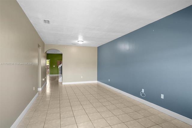 empty room with light tile patterned floors