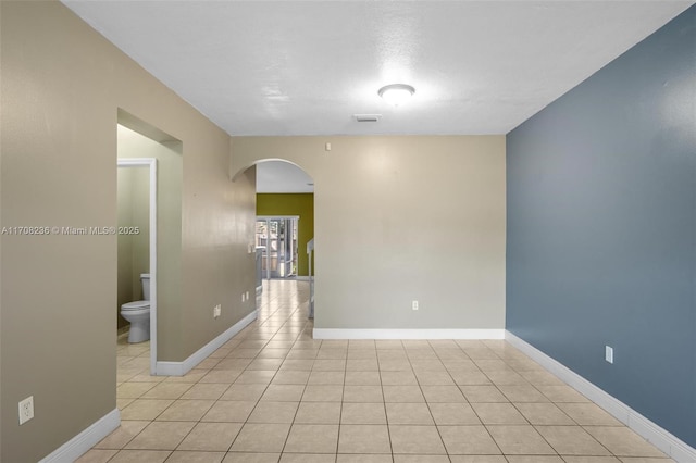 spare room with light tile patterned floors