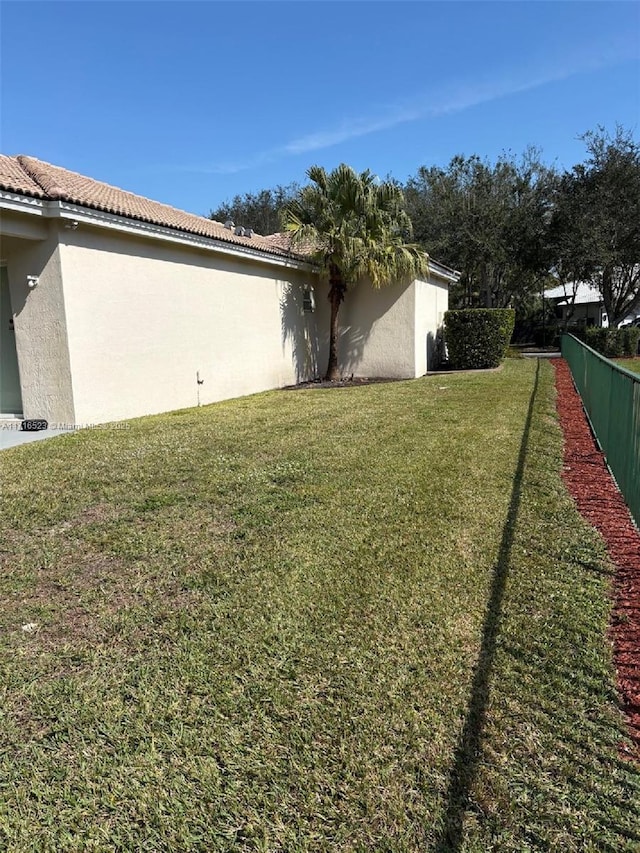 view of home's exterior featuring a lawn