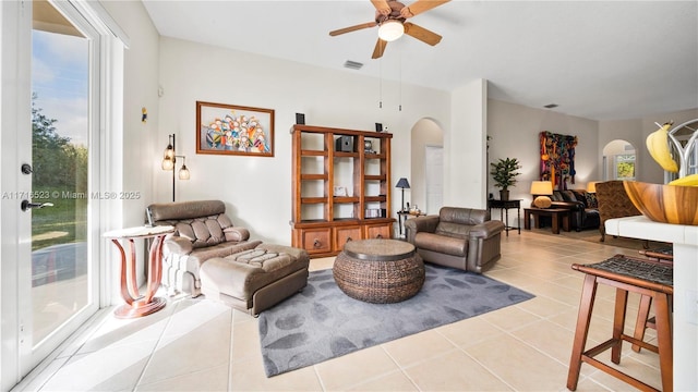 living room featuring ceiling fan and light tile patterned floors