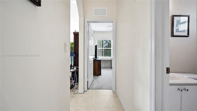 hallway with light tile patterned floors