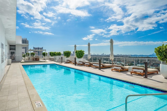 view of swimming pool featuring a patio area