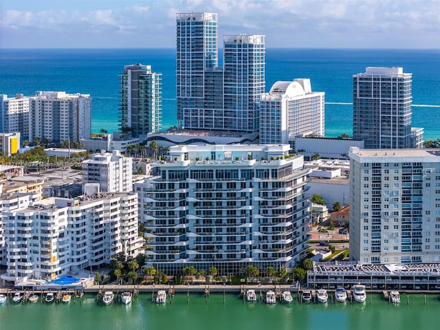 birds eye view of property featuring a water view