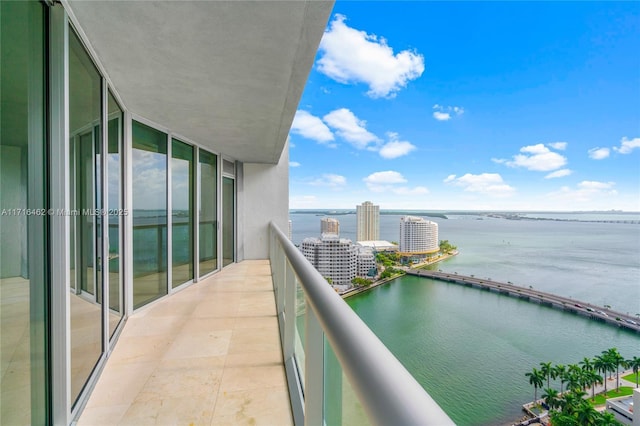 balcony featuring a water view