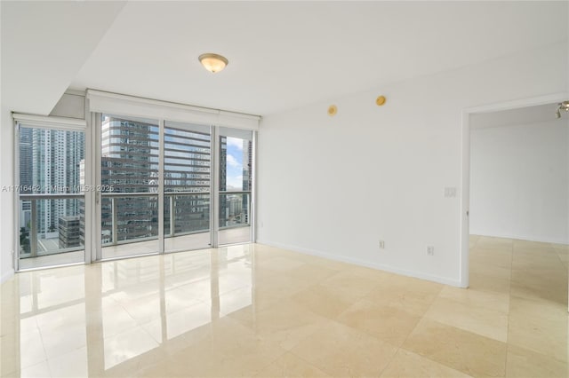 empty room featuring expansive windows