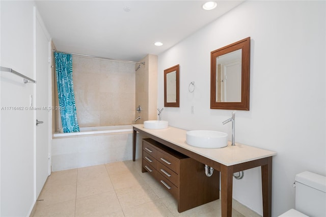 full bathroom with shower / tub combo, vanity, and toilet