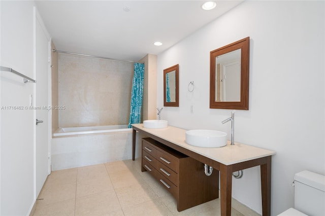 full bathroom with shower / bath combo, toilet, and vanity