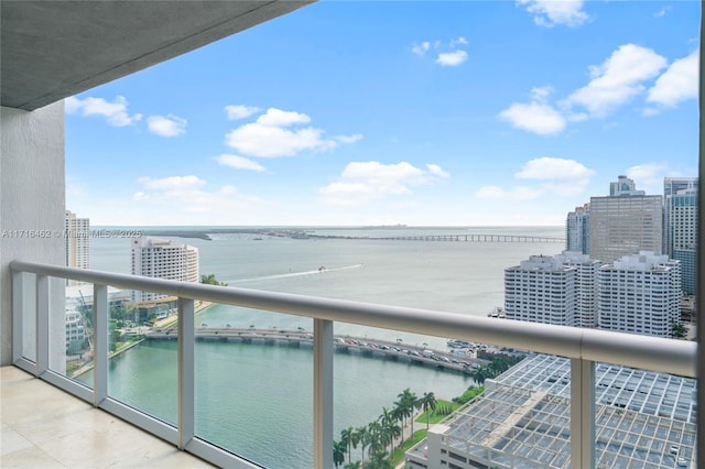 balcony featuring a water view