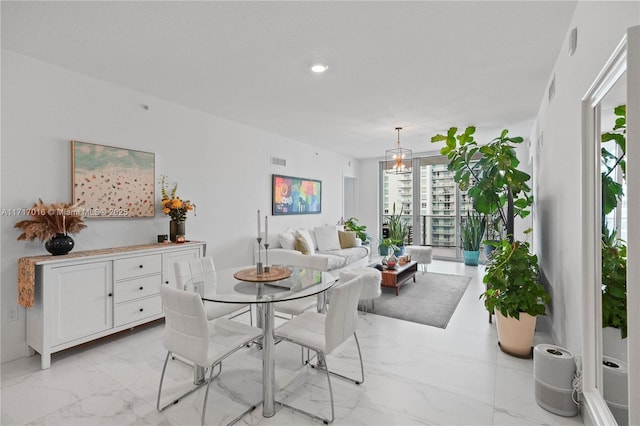 dining space with a chandelier