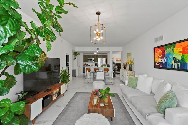 living room featuring a notable chandelier