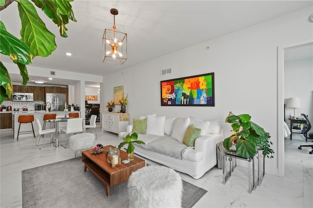 living room featuring an inviting chandelier