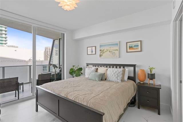 bedroom featuring access to outside and expansive windows