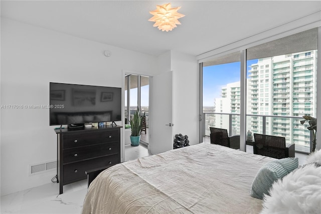 bedroom with a wall of windows